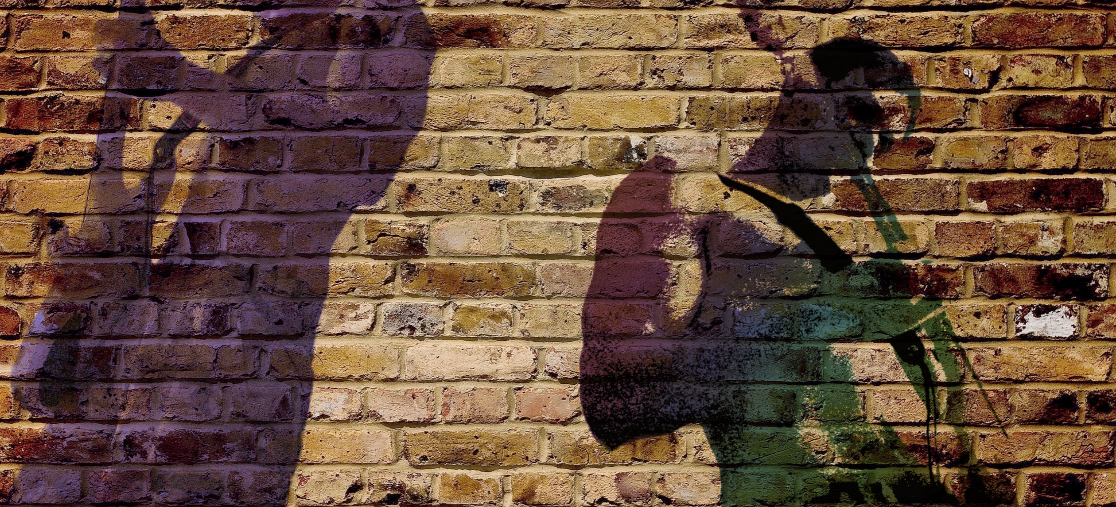 The wide shot behind the logo. Brick, a wall of guitars, a bench mid-session — something with room in the middle, because the mark sits over it.